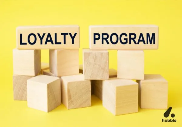 Wooden blocks stacked with "Loyalty Program" written on them, symbolizing gamification in customer loyalty programs.
