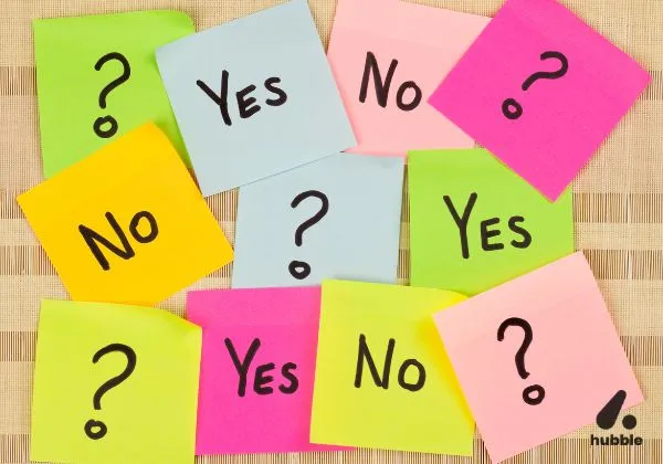 Colorful sticky notes with "Yes," "No," and question marks, representing consumer decision-making in behavioral economics
