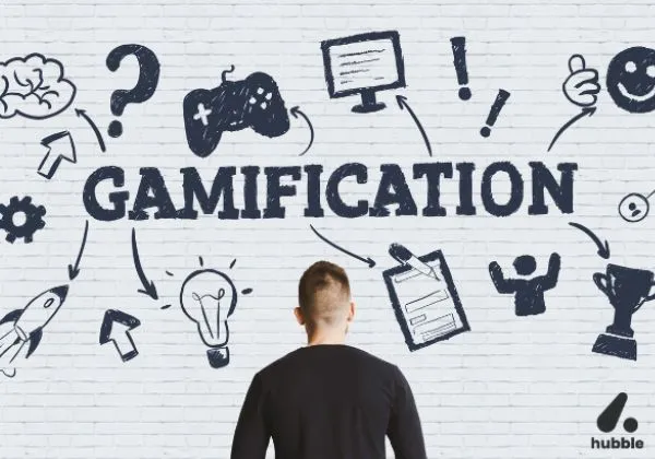 Man looking at a wall with "Gamification" and related icons, symbolizing its role in sales performance and training