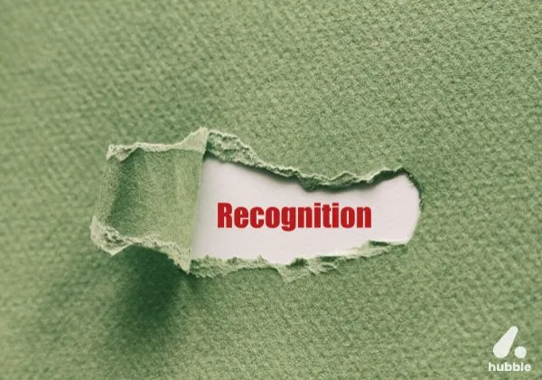Torn green paper revealing the word "Recognition," representing the importance of real-time recognition.